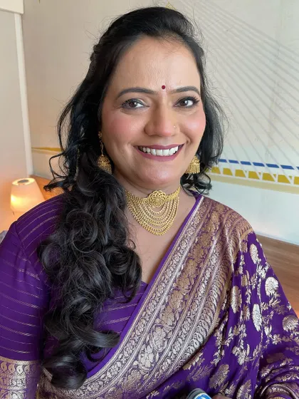 A beautiful, smiling portrait of the mother of the bride. I used techniques for mature skin to give her a radiant, youthful glow.