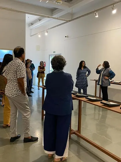 Another view of the walkthrough, showing the engaged group of visitors.