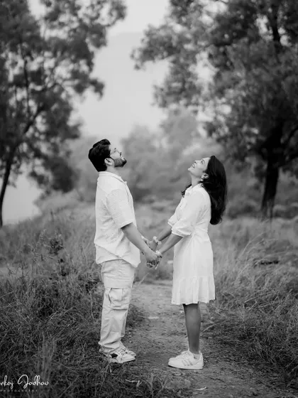 A shared laugh in black and white. This candid moment from Nutan and Shubham's pre-wedding shoot captures their genuine joy.