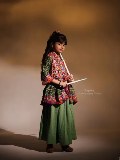 Pahal dressed in a traditional Garba outfit, ready to dance. This portrait captures the vibrant culture and her youthful energy, making for a beautiful festive kids' photoshoot.