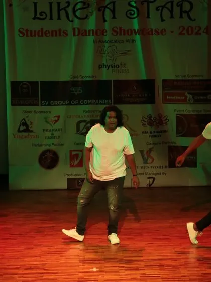 The dancers move across the stage with style and energy.