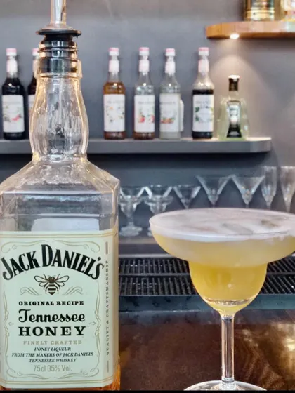 Another look at our popular Jack Daniel's Honey cocktail, a testament to our skill in creating well-balanced drinks.