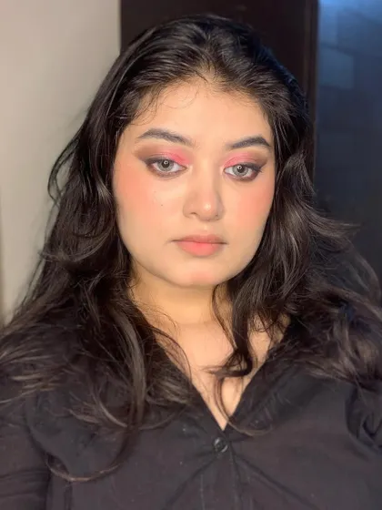 A smokey eye with a pop of pink on the inner lid.