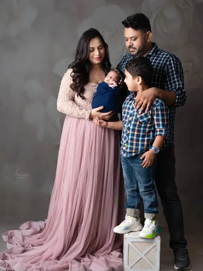 The whole family admiring the newest, tiniest member. A perfect portrait of a growing family.