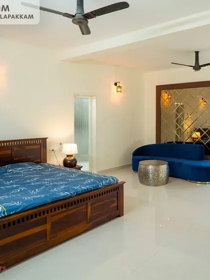 A duplicate image of the expansive and elegantly styled master bedroom at the Sithalapakkam villa.