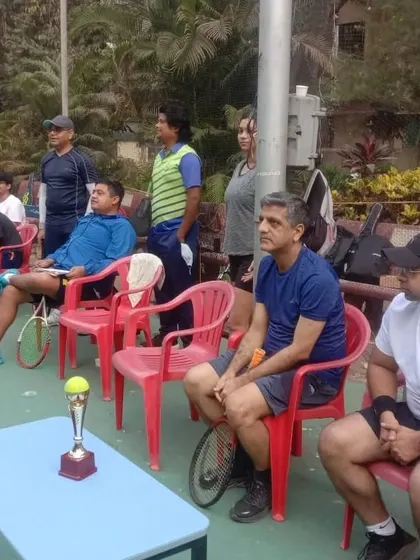 The spirit of competition and community at the Friendship Cup Tennis Tournament at Bandra YMCA. Players watch and support each other between matches.