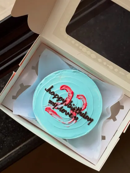 A lovely blue bento cake for a 22nd birthday celebration. The message "happy birthday my love" is written over a red and white brushstroke heart design.