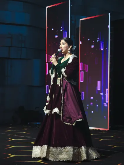 A profile shot of me on stage in a rich, velvet outfit, perfect for a grand and royal-themed social event.