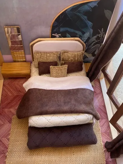 Before a single piece of full-size furniture is built, a detailed scale model can bring an interior design concept to life. This miniature bedroom prototype helps visualize space, texture, and layout in a tangible way.