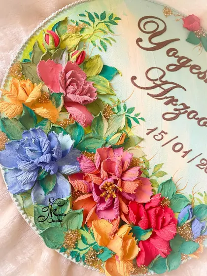 A close-up look at the details on this nameplate. You can see the different types of flowers I sculpted, from multi-petaled peonies to simpler blossoms, all arranged to create a lush, garden-like effect.