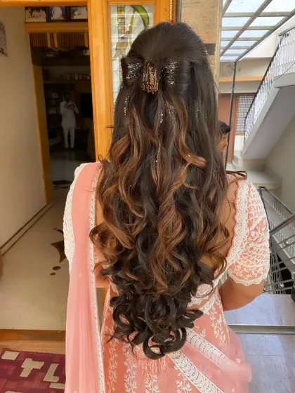 This hairstyle with a claw clip is a great example of modern, effortless chic for a special event.