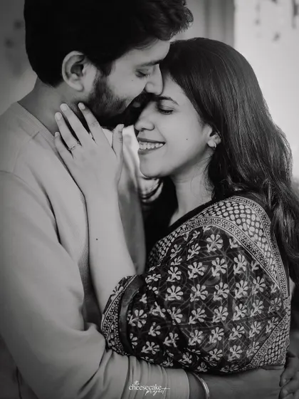 A beautiful, serene black and white portrait of the couple embracing.