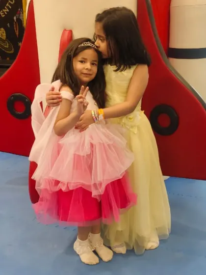 A sweet moment between two friends during a party. Our play area is a space where friendships blossom.