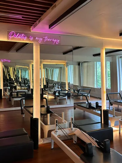 Our studio is lined with mirrors so my trainers and I can keep a close eye on your form. Plus, the "Pilates is my therapy" sign is a constant reminder of why we're here.