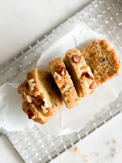Indulge in the rich, nutty flavor of our Pecan Pound Loaf. Sliced to show its wonderful texture, every bite is a decadent treat for your taste buds.