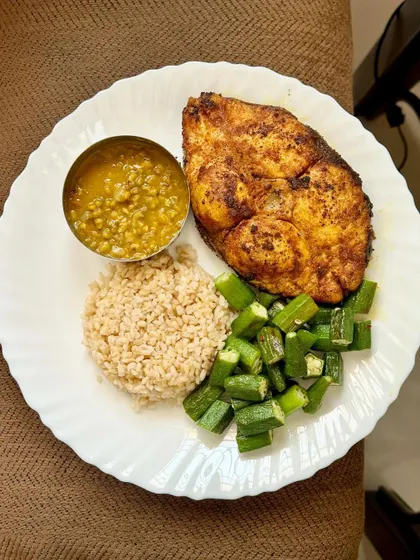 A repeat of the delicious high-protein meal with pan-fried kingfish, broken wheat, dal, and sautéed okra.