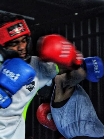 A well-timed counter punch during a youth sparring session. We teach our boxers to react instinctively and turn defense into offense.