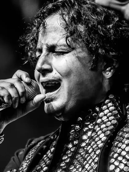 Lost in the music, connected to the divine. This is the state of 'suroor' we aim to create at every performance. A black and white moment capturing the raw emotion of our lead vocalist during a live show at Bangalore Club.