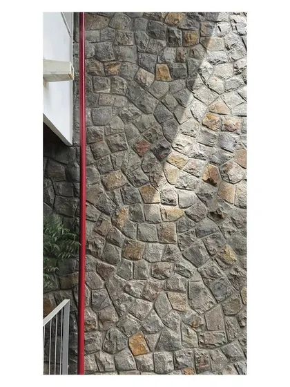 The south-facing facade uses staggered floor plates to block the harsh summer sun while allowing winter sun to enter, a key passive design strategy.