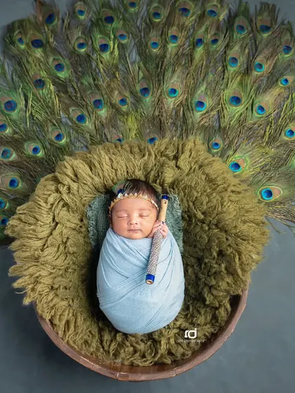 Another version of the Krishna theme, this time with a blue wrap and a beautiful display of peacock feathers.