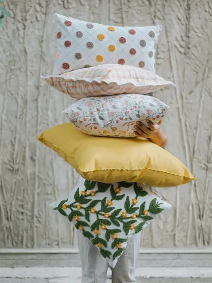 Eeny, meeny, miny, moe... which cushion to choose? With so many beautiful designs, from embroidered florals to colorful polka dots, it's hard to pick just one. Why not get a few to mix and match?