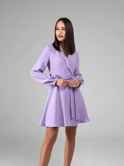I also create custom dresses, like this elegant lavender blazer dress. It features a wrap design with a self-tie belt and bishop sleeves, offering a sophisticated silhouette that's perfect for formal events.