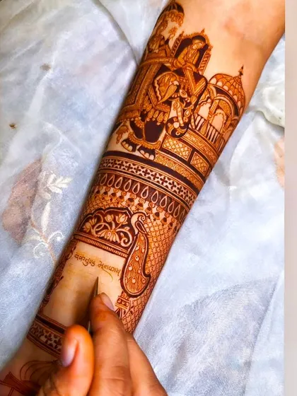 The artistry in progress, showing how I add shading and detail to bring a wedding scene to life on the forearm.