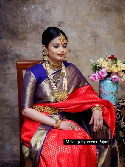 A seated portrait from the vintage shoot. The composition and the model's pose add to the timeless, classic feel of the image.