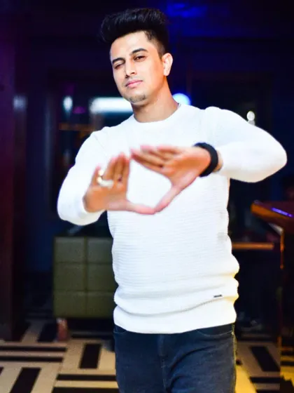 Making the triangle sign, a symbol of connection and energy. It's all about creating a unified vibe.