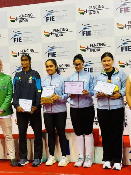Our athletes on the podium after the FIE Women's Satellite Tournament. This image captures the pride and accomplishment of competing against some of the best fencers in the circuit.
