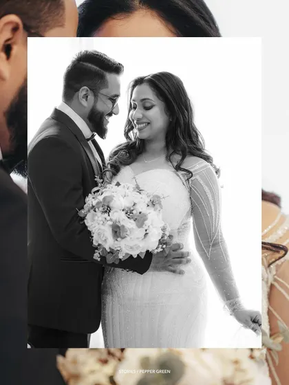 A black and white portrait of Amaya and Deepak, full of smiles and happiness. This classic style emphasizes the emotion and connection between the couple.