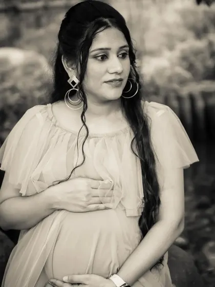 A thoughtful and elegant black and white portrait of the mom-to-be. The classic style gives the photo a timeless, cinematic quality.