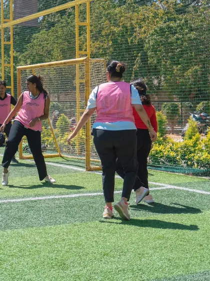 The mothers' team in action during a football match at the Rush Festival. It's great to see them showcasing their skills on the pitch.
