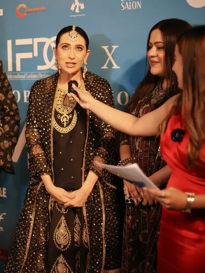 Celebrity Karisma Kapoor being interviewed on the red carpet, showcasing the glamour and excitement of the events our students participate in.