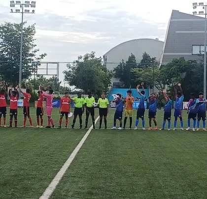 A moment of mutual respect between our team and the opposition before the match.