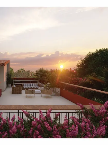 The terrace of the 'Red Haus' is a space designed for connection, perfect for enjoying evening sunsets with coffee. Surrounded by bougainvilleas, it’s a simple yet beautiful extension of the living area, blurring the lines between inside and out.