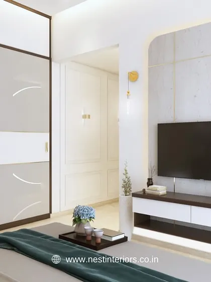 A 3D view of a bedroom showing the TV unit set within an arched niche with backlighting. This design creates a soft, elegant focal point opposite the bed.
