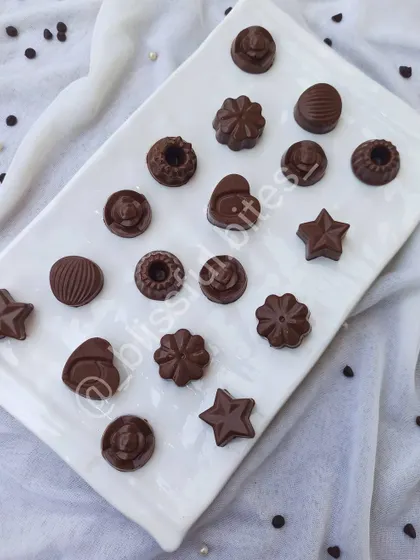 A wide assortment of my homemade chocolates, showing the variety of shapes and sizes. Each one is crafted by hand in my kitchen.
