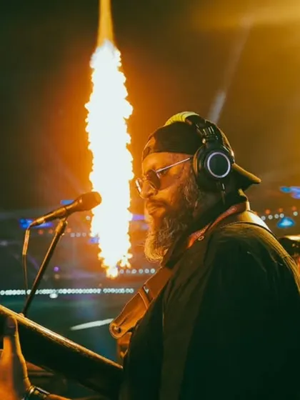Our bassist, Nexus, with pyros blasting in the background. He's the genius head of the band and his energy on stage is incredible.