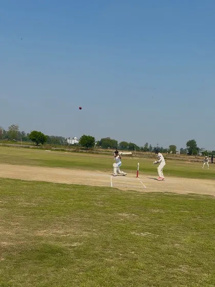 Aditi plays a shot, showcasing her excellent technique and timing.