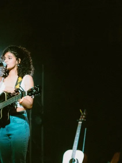 A shot from the night I opened for When Chai Met Toast. You can see my guitar, my microphone, and me, ready to share my original music.
