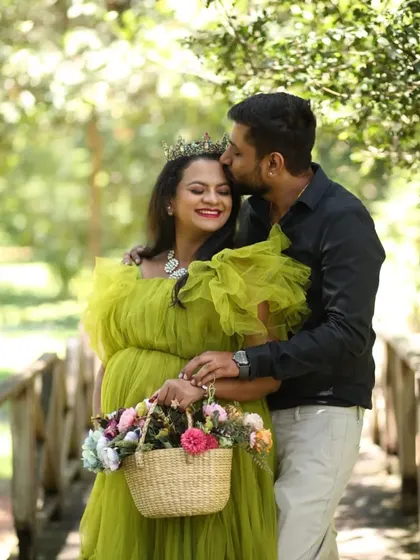 A romantic moment on a bridge. For this look, I created soft makeup and styled her hair to go with the whimsical green dress and flower crown.