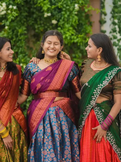 A candid and joyful group photo of three friends sharing a laugh. I aim to capture the genuine connection between people at events.