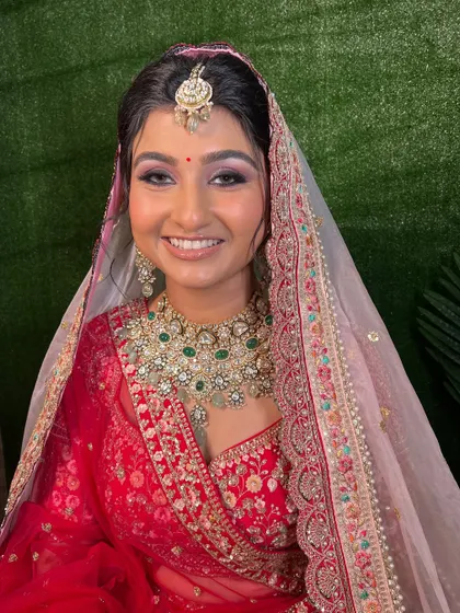 Another shot of this stunning bride. The makeup is designed to photograph beautifully, with a focus on defined features and glowing skin.