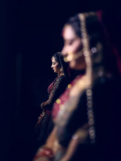 A creative bridal portrait using a reflection to create a layered and interesting composition.