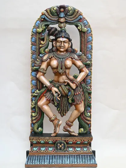 The 5-foot wooden dancing Apsara, shown against a clean background to emphasize her form and the intricate, colorful details of her attire and the surrounding arch.