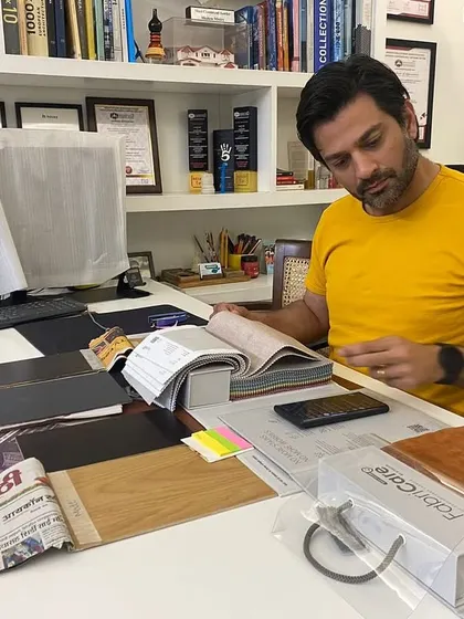 A candid shot of me at my desk. This is the heart of our creative process, where ideas are born and strategies are formed.