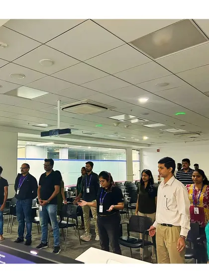A duplicate shot of the group standing attentively during a mindfulness workshop.