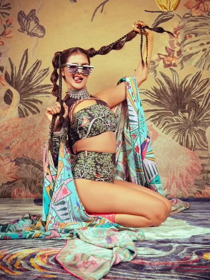 A playful shot showing how the makeup and hair work with accessories to create a cohesive and interesting character for the editorial.