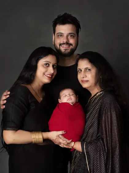 Three generations of love. A beautiful portrait of a new baby with parents and grandmother.